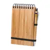 Block Notes A6 con copertina in bambù rilegatura a aspirale sul superiore e 70 fogli a righe e penna a sfera in bambù in refill blu