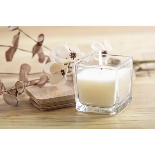 Candela profumata a base di cera vegetale in contenitore di vetro con coperchio in bambù