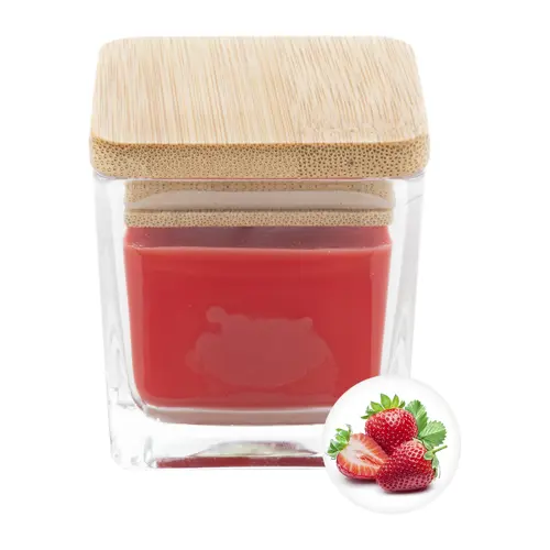 Candela profumata a base di cera vegetale in contenitore di vetro con coperchio in bambù