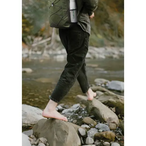 Zaino in poliestere 600D RPET  con cordino e tasca frontale e sui lati tasche a rete 30X14X45cm