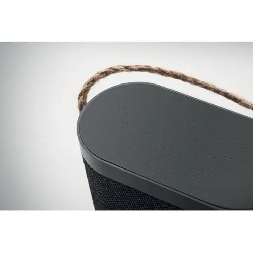 Speaker in ABS e tessuto poliestere RPET con caricatore wireless in bambù e maniglia in iuta