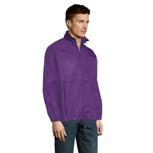 Giacca a vento da adulto unisex colori assortiti impermeabile con sistema pieghevole in bag ed elastici da allacciare in vita e cappuccio a scomparsa in nylon 210gr