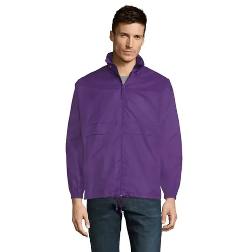 Giacca a vento da adulto unisex colori assortiti impermeabile con sistema pieghevole in bag ed elastici da allacciare in vita e cappuccio a scomparsa in nylon 210gr